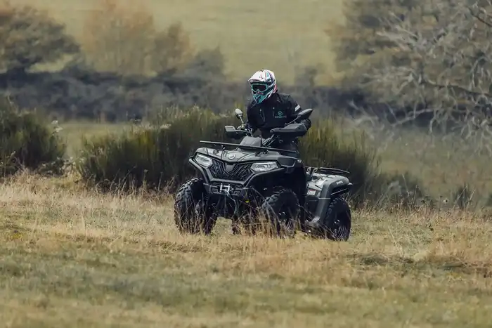 Enduro bike and CFMOTO 625 quad together on a mountain trail in the Pirin Mountains, Bulgaria