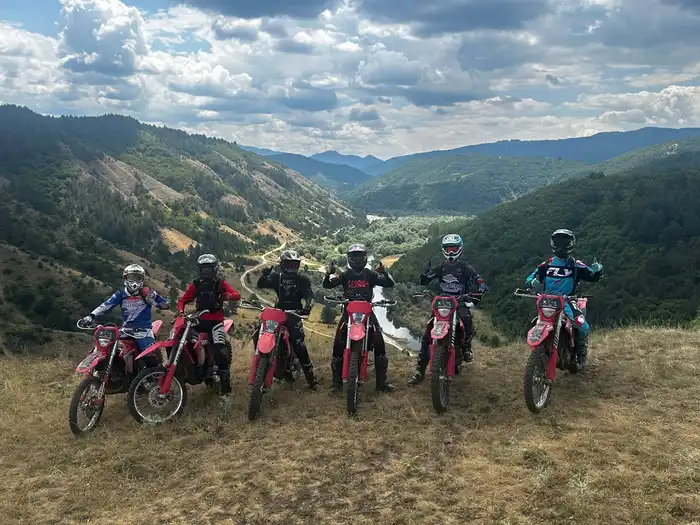 Enduro rider on a forest trail in the Pirin Mountains above Bansko, Bulgaria, on a 2026 GASGAS bike